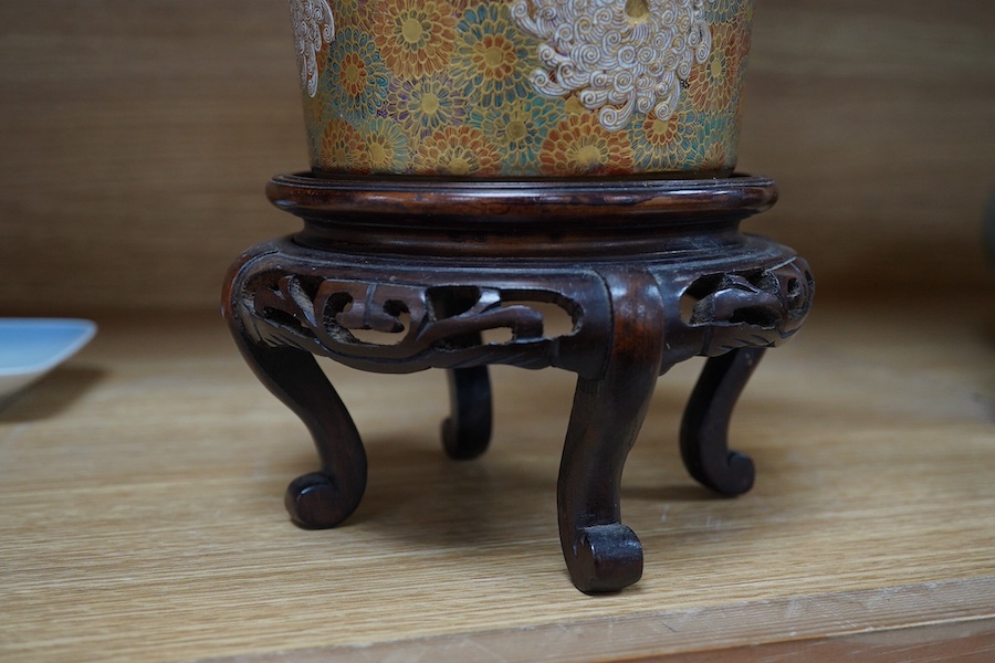 A Japanese Satsuma pottery lidded jar, Meiji period, decorated and gilded with flowers, signed to the base, 14cm high. Condition - lid restored